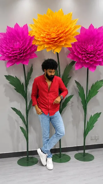 Osura with giant paper dahlias in the workshop