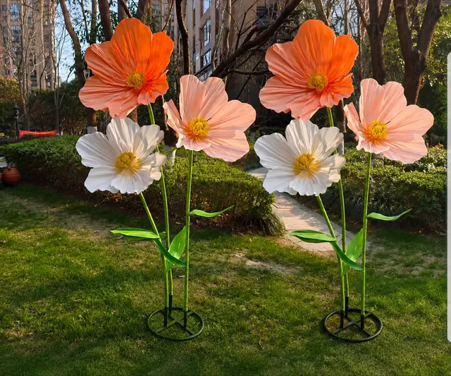 Giant cosmos paper flowers in a garden